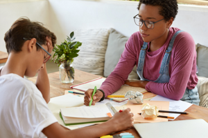 Parent Helping Child With Their Homework