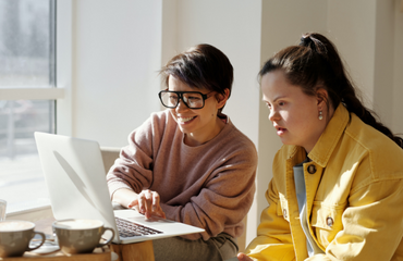 Feature Panel Support Worker And SEND Student On Laptop