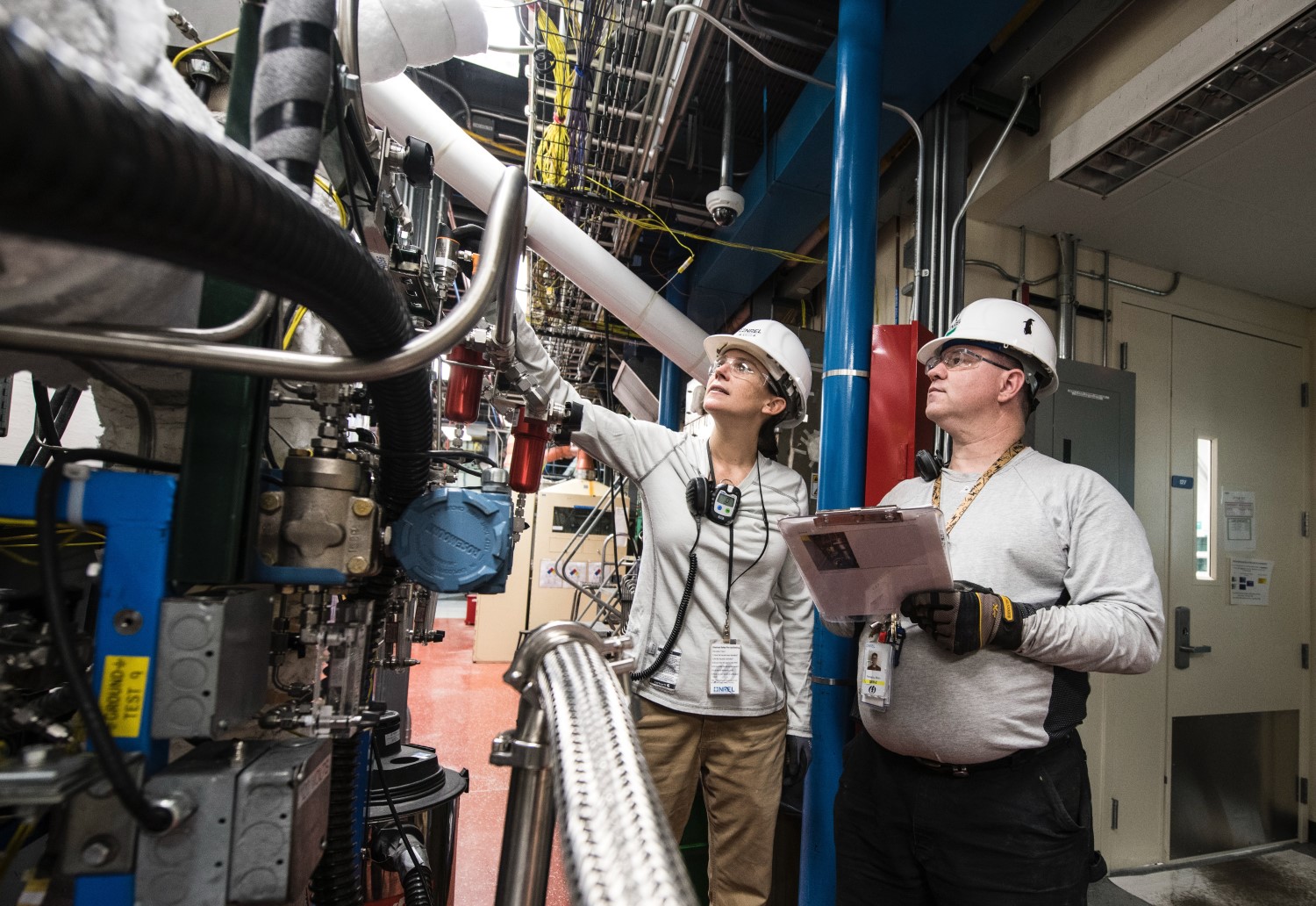 Engineers Working With Equipment